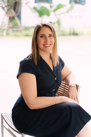 Anna Downs, Somnii's expert team member and maternal wellness advocate, smiling in a professional headshot.