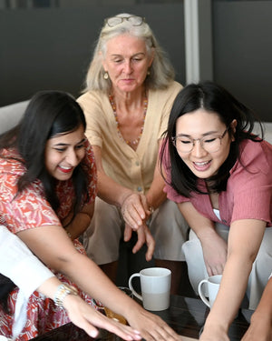 The Somnii Sessions experience in action: mothers and women of all generations engaging in a playful, interactive session to break down maternal mental health barriers.